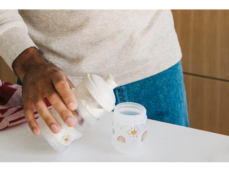 Dávkovač na sušené mléko Husa